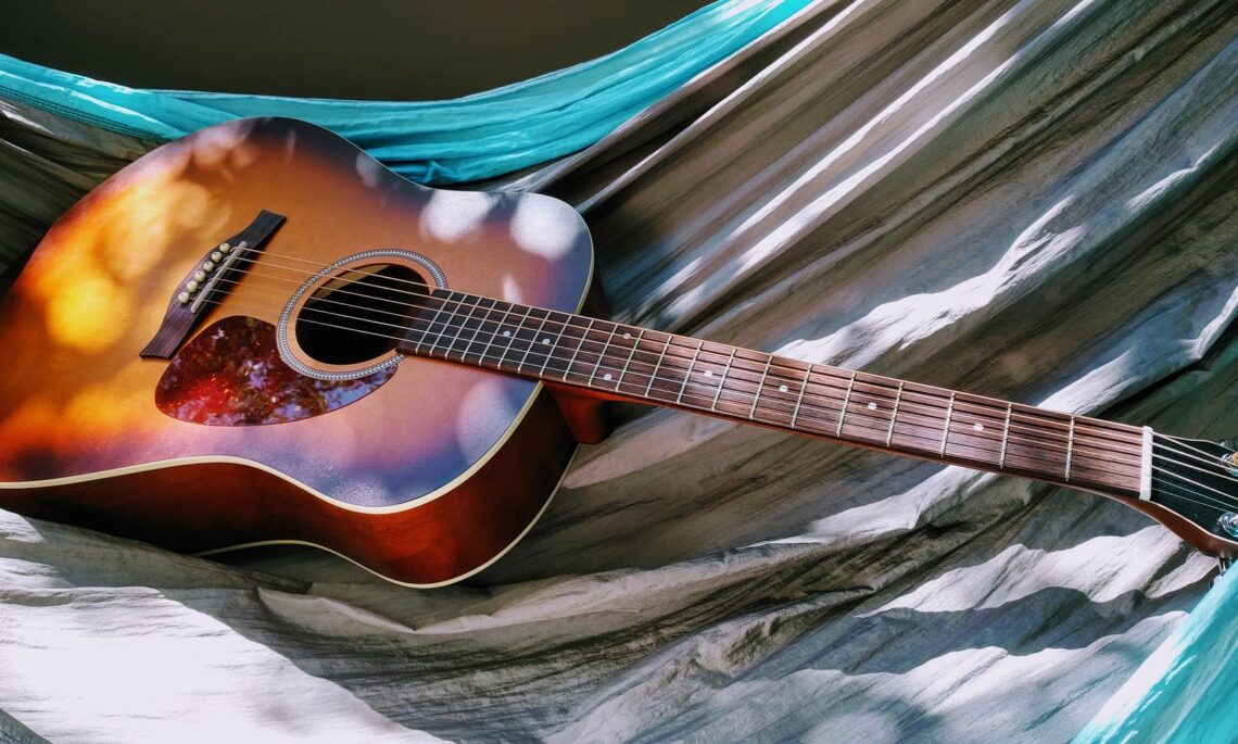 https://www.pexels.com/photo/acoustic-guitar-on-hammock-625788/